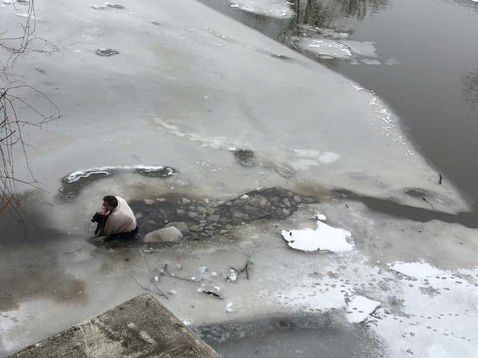 man save dog trapped frozen waters