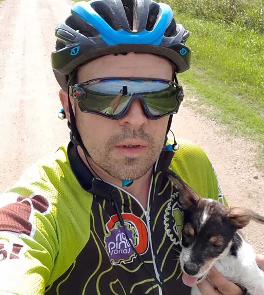 Cyclist and abandoned puppy