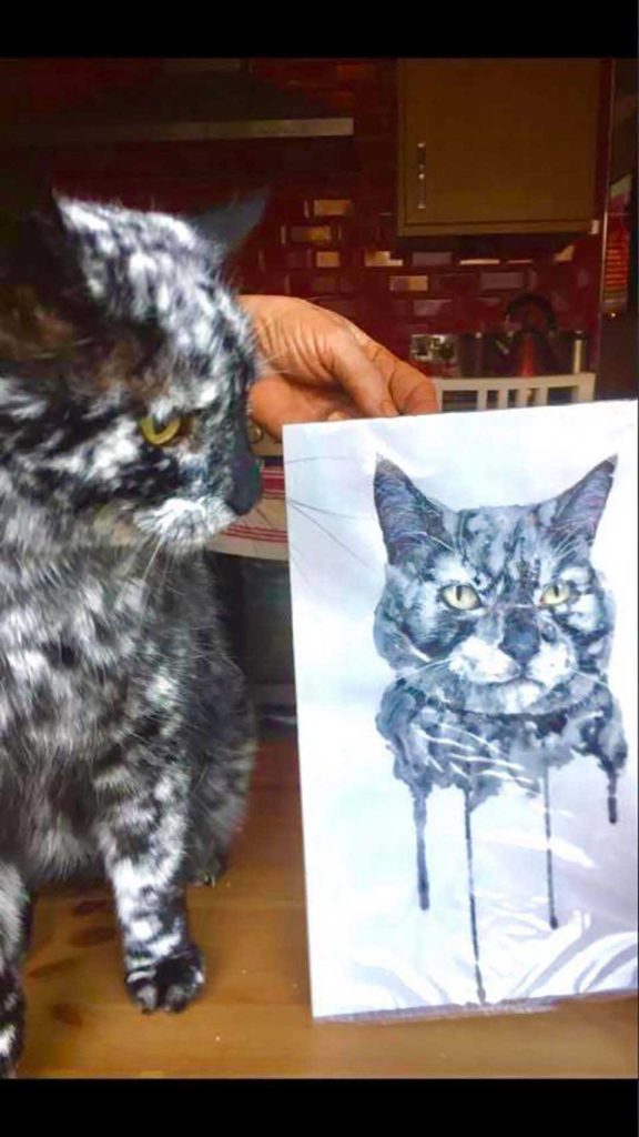 Beautiful cat and his drawing