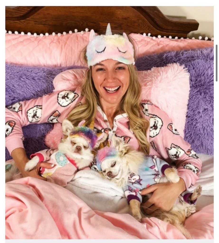 Woman and her puppies in pajamas