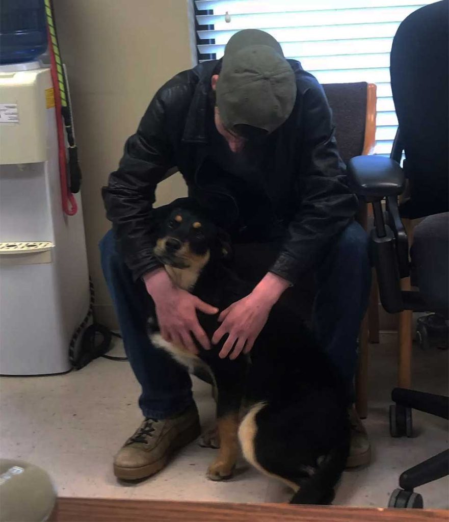 homeless young man meets dog shelter