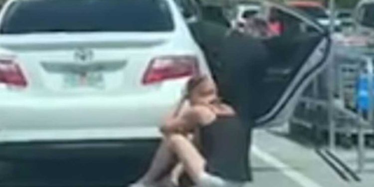 woman fell ground after what she saw in the car dog